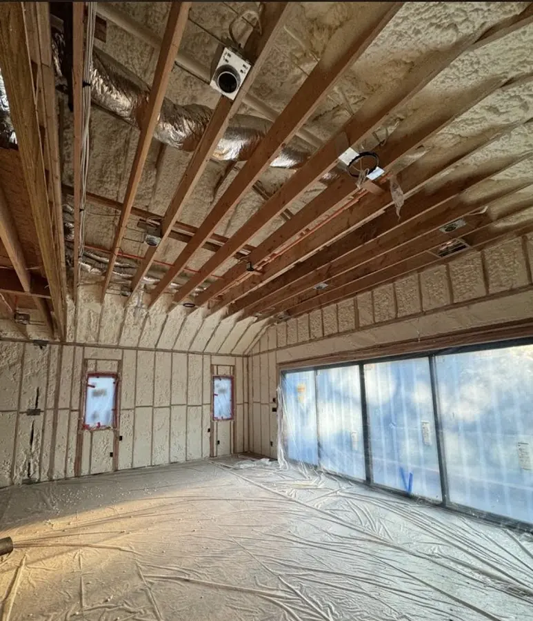 Interior walls and ceiling insulated with spray foam during new construction in Lloyd